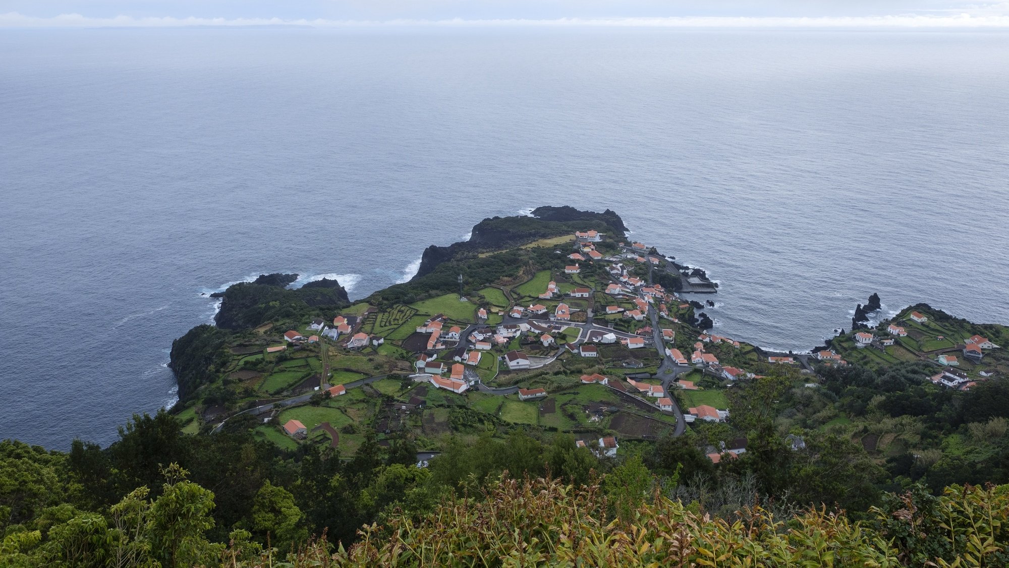 epa09851608 A view on Faja dos Cubres at Concelho de Velas, Sao Jorge island, Azores, Portugal, 26 March 2022. The island of Sao Jorge has counted about 12,700 earthquakes since 19th March, more than double of all those recorded in the Azores archipelago since 2021.  EPA/ANTONIO ARAUJO