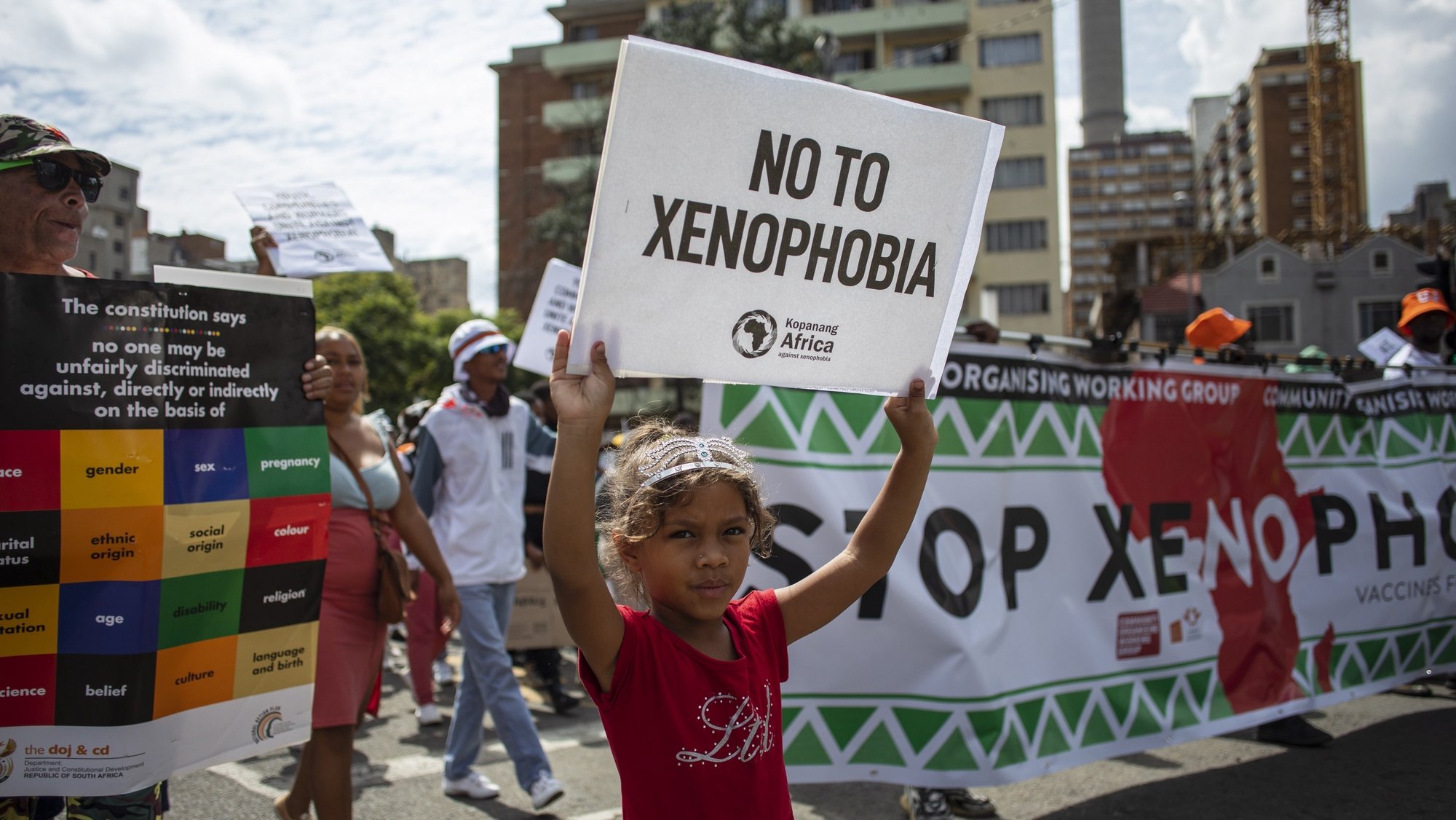 epa09850519 People take to the streets during a rally organized by the Kopanang Africa against Xenophobia organization, calling for an end to &#039;xenophobic sentiments and groups&#039; in Johannesburg, South Africa, 26 March 2022. Protesters mainly denounced the recent formation and increasing popularity of anti foreigner group &#039;Operation Dudula&#039; which actively calls for the removal of foreign residents.  EPA/Kim Ludbrook