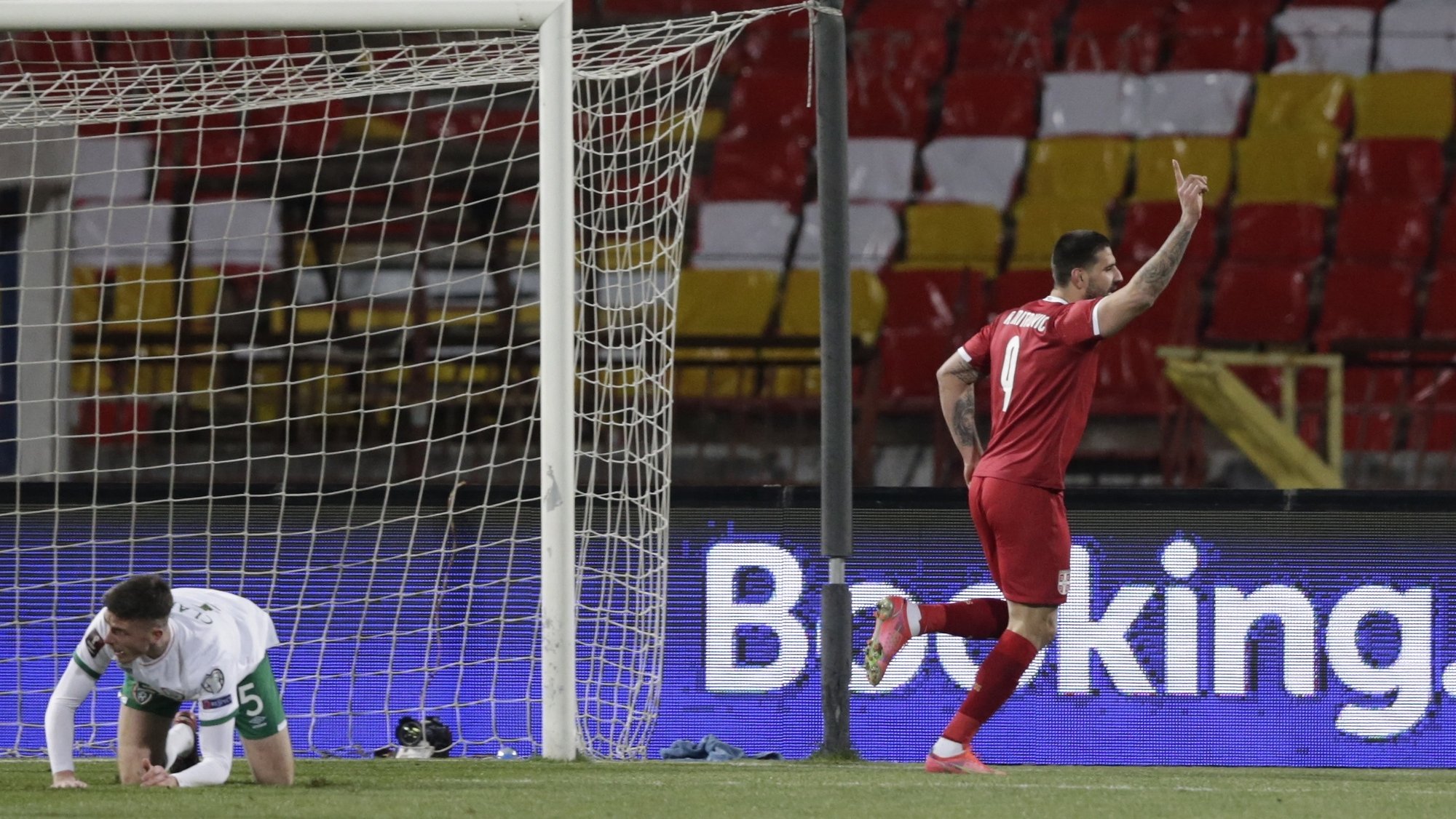 epa09094972 Serbiaâ€™s Aleksandar Mitrovic (R) celebrates after scoring his second goal during the FIFA World Cup 2022 qualification match between Serbia and Ireland in Belgrade, Serbia, 24 March 2021.  EPA/ANDREJ CUKIC