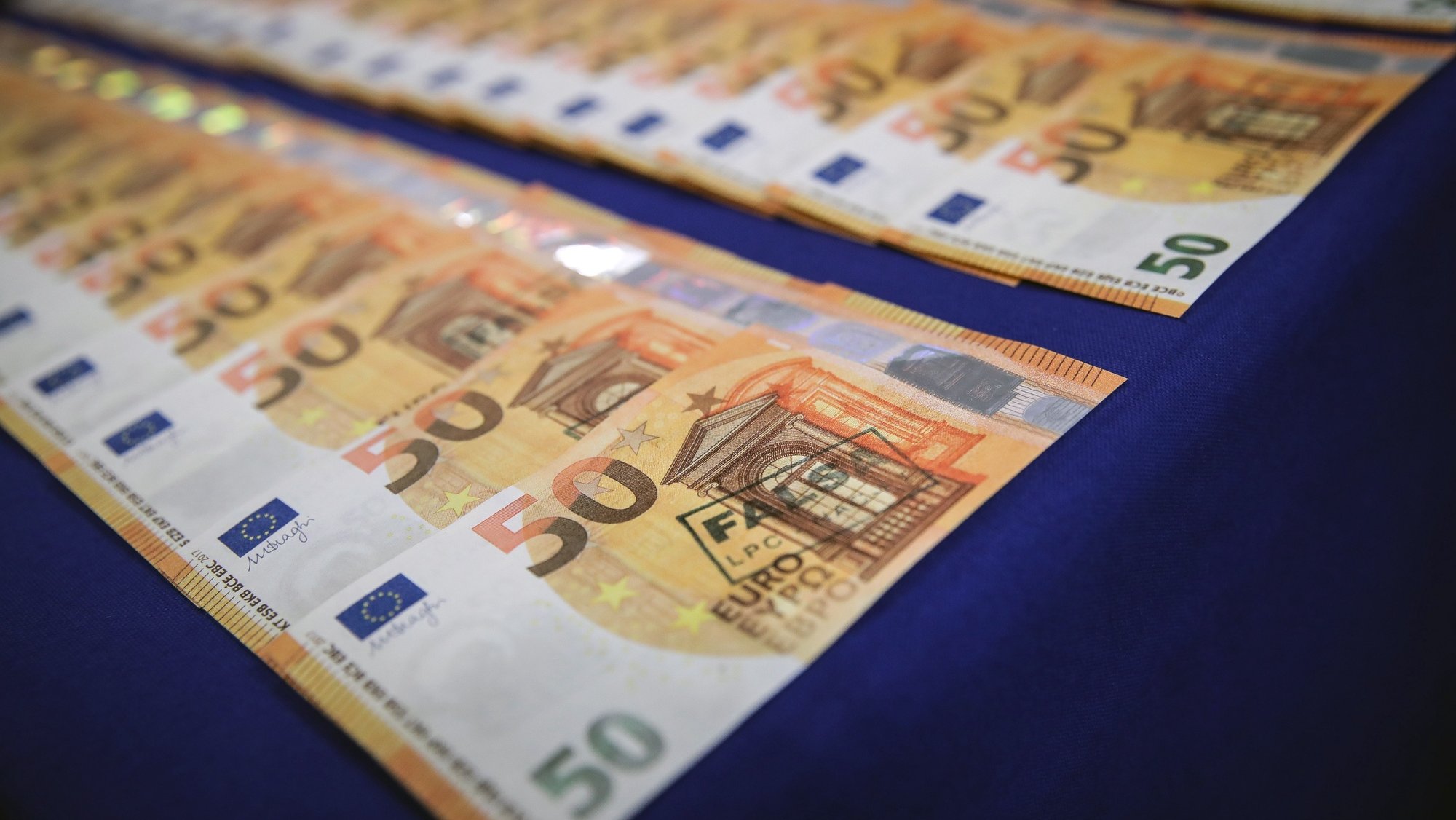 epa07829899 Counterfeit money captured by the Criminal Investigation Police (PJ) in Operation Deep Money is diplayed at the Judicial Police Building in Lisbon, Portugal, 09 September 2019. In collaboration with EUROPOL, PJ has uncovered one of the largest European networks for counterfeit currencies. Five people were arrested and more than 1,800 counterfeit 50 and 10 euro banknotes seized.  EPA/MARIO CRUZ