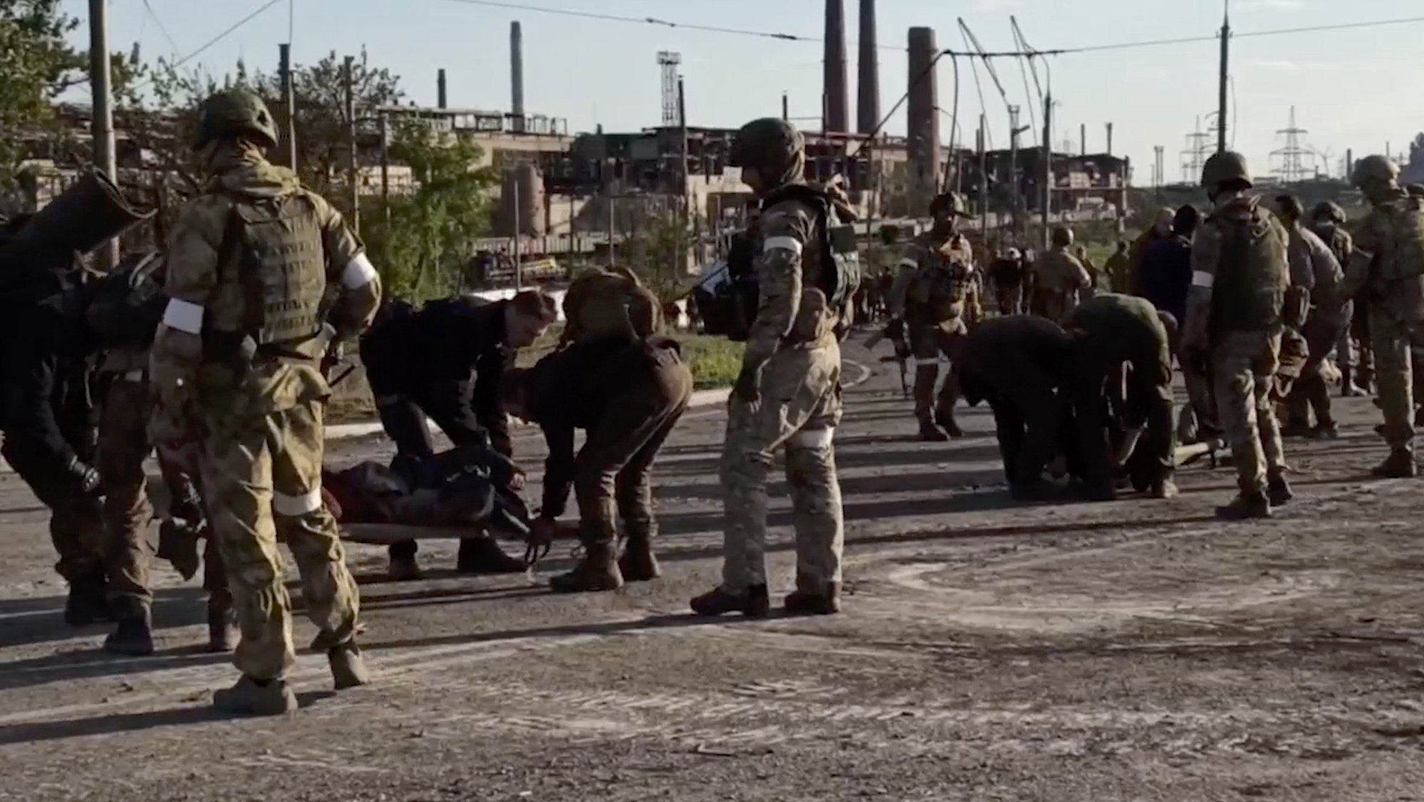 epa09952371 A handout still image taken from a handout video made available by the Russian Defence Ministry&#039;s press service shows Russian servicemen frisk Ukrainian servicemen as they are being evacuated from the besieged Azovstal steel plant in Mariupol, Ukraine, 17 May 2022. A total of 265 Ukrainian militants, including 51 seriously wounded, have laid down arms and surrendered to Russian forces, the Russian Ministry of Defence said on 17 May 2022. Those in need of medical assistance were sent for treatment to a hospital in Novoazovsk, the ministry states further. Russian President Putin on 21 April 2022 ordered his Defence Minister to not storm but to blockade the plant where a number of Ukrainian fighters were holding out. On 24 February, Russian troops invaded Ukrainian territory starting a conflict that has provoked destruction and a humanitarian crisis. According to the UNHCR, more than six million refugees have fled Ukraine, and a further 7.7 million people have been displaced internally within Ukraine since.  EPA/RUSSIAN DEFENCE MINISTRY PRESS SERVICE HANDOUT  BEST QUALITY AVAILABLE HANDOUT EDITORIAL USE ONLY/NO SALES