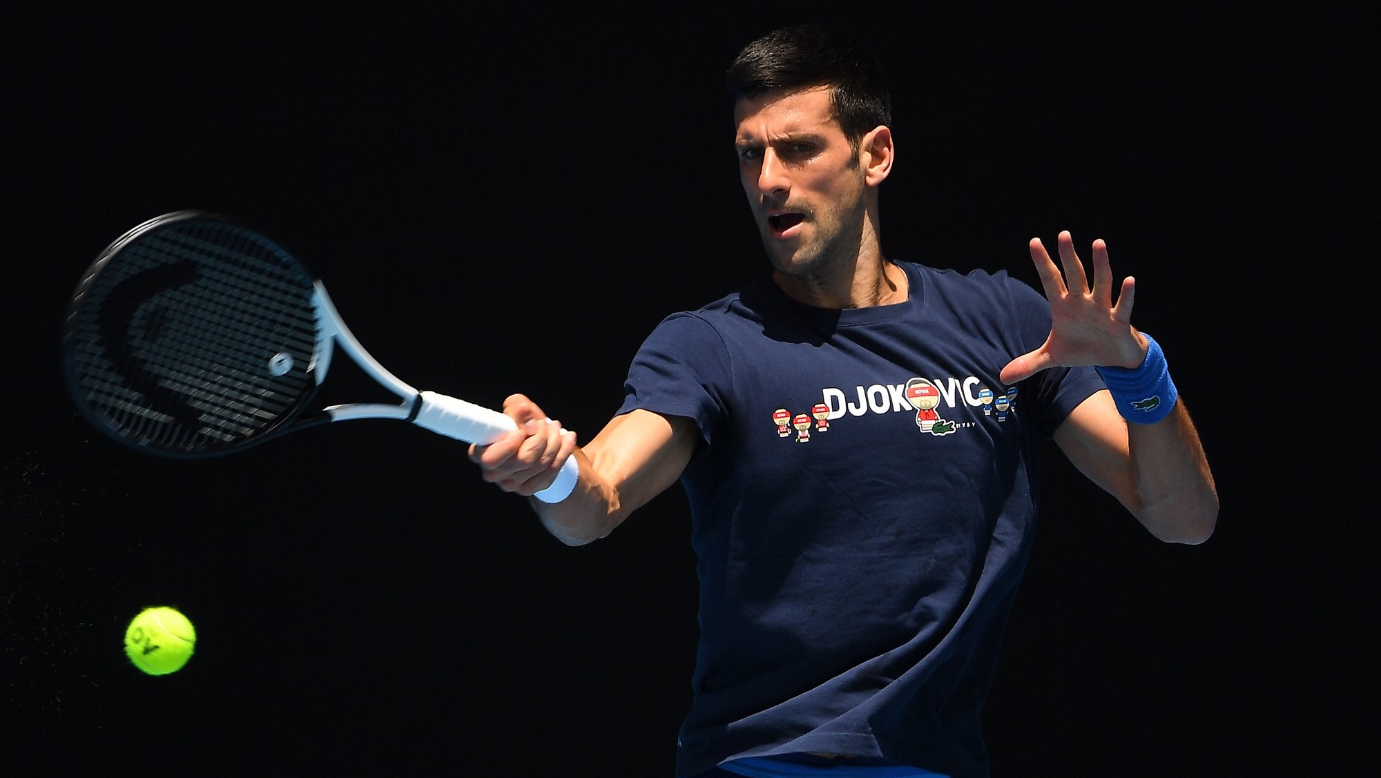 epa09679697 Novak Djokovic of Serbia is seen in action  during a training session at Melbourne Park in Melbourne, Australia, 12 January 2022.  EPA/JAMES ROSS  AUSTRALIA AND NEW ZEALAND OUT
