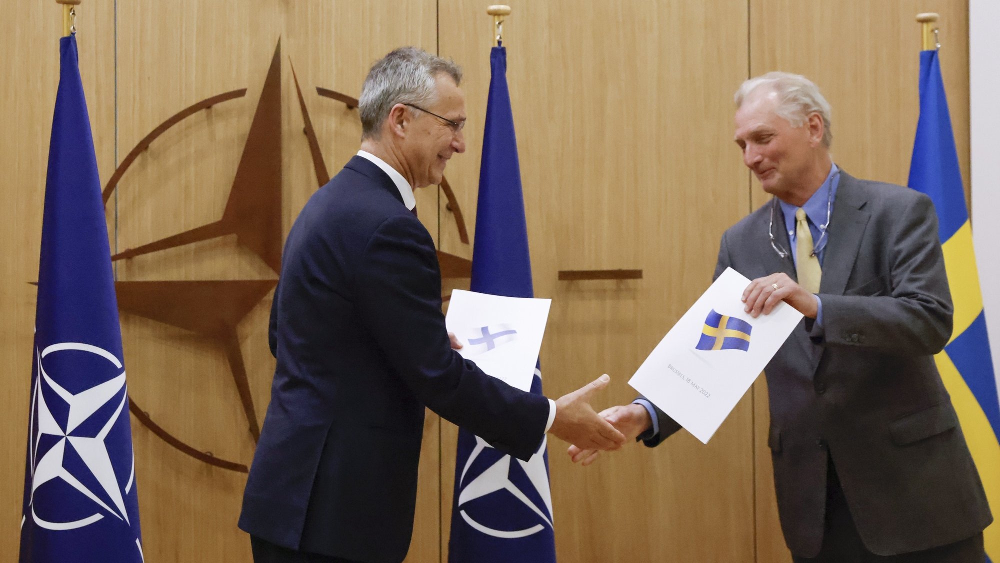 epa09954346 NATO Secretary-General Jens Stoltenberg (L) and Sweden&#039;s Ambassador to NATO Axel Wernhoff shake hands during a ceremony to mark Sweden&#039;s and Finland&#039;s application for membership in Brussels, Belgium, 18 May 2022. Finland and Sweden are applying for NATO membership as a result of Russia&#039;s invasion of Ukraine. The move would bring the expansion of the Western military alliance to 32 member countries.  EPA/JOHANNA GERON / POOL