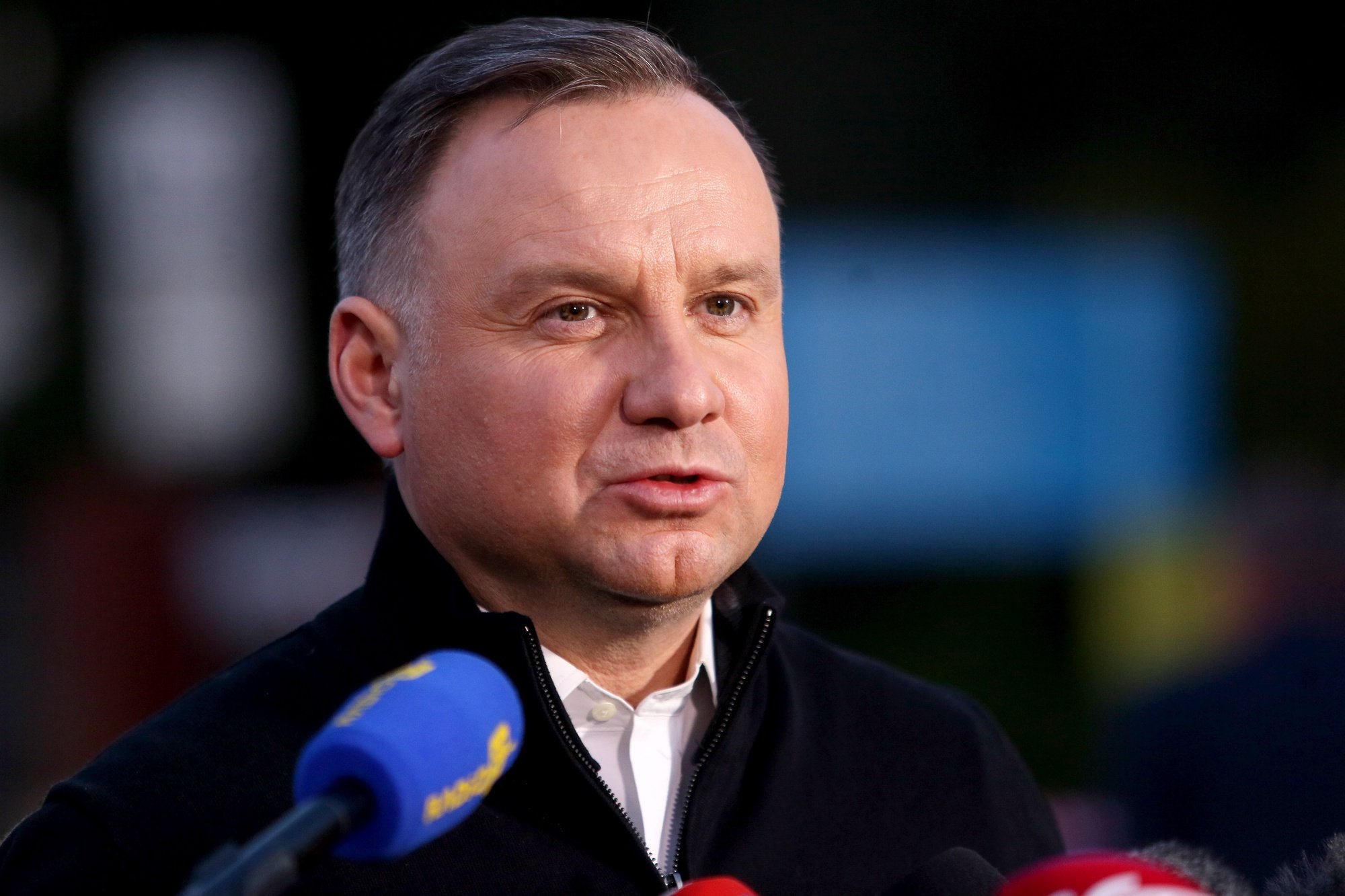 epa09904970 Polish President Andrzej Duda during a press conference in front of the Zofiowka coal mine in Jastrzebie-Zdroj, southern Poland, 23 April 2022. A tremor shook the Zofiowka coal mine in the early hours on 23 April, leaving ten miners missing, according to a statement by the mining conglomerate JSW, the mine owner. The tremor involved &#039;an intensive outflow of methane&#039;, JSW said. Twelve rescue teams have been trying to reach the missing miners. High concentration of methane may hinder the rescue operation as the pipeline supplying fresh air to the location has been damaged. A rescue operation is currently underway.  EPA/ZBIGNIEW MEISSNER POLAND OUT