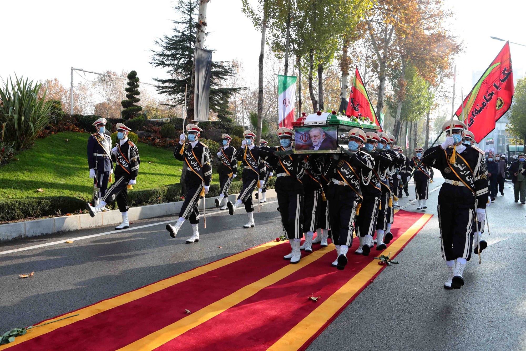 epa08852619 A handout photo made available by the Iranian defence ministry office shows soldiers carrying the coffin of slain Iranian nuclear scientist Mohsen Fakhrizadeh during funeral procession inside the Iranian defense ministry in Tehran, Iran, 30 November 2020. Media reported that Iran blamed Israel for the assassination of Mohsen Fakhrizadeh, a senior Iranian nuclear scientist.  EPA/DEFENCE MINISTRY OFFICE HANDOUT  HANDOUT EDITORIAL USE ONLY/NO SALES