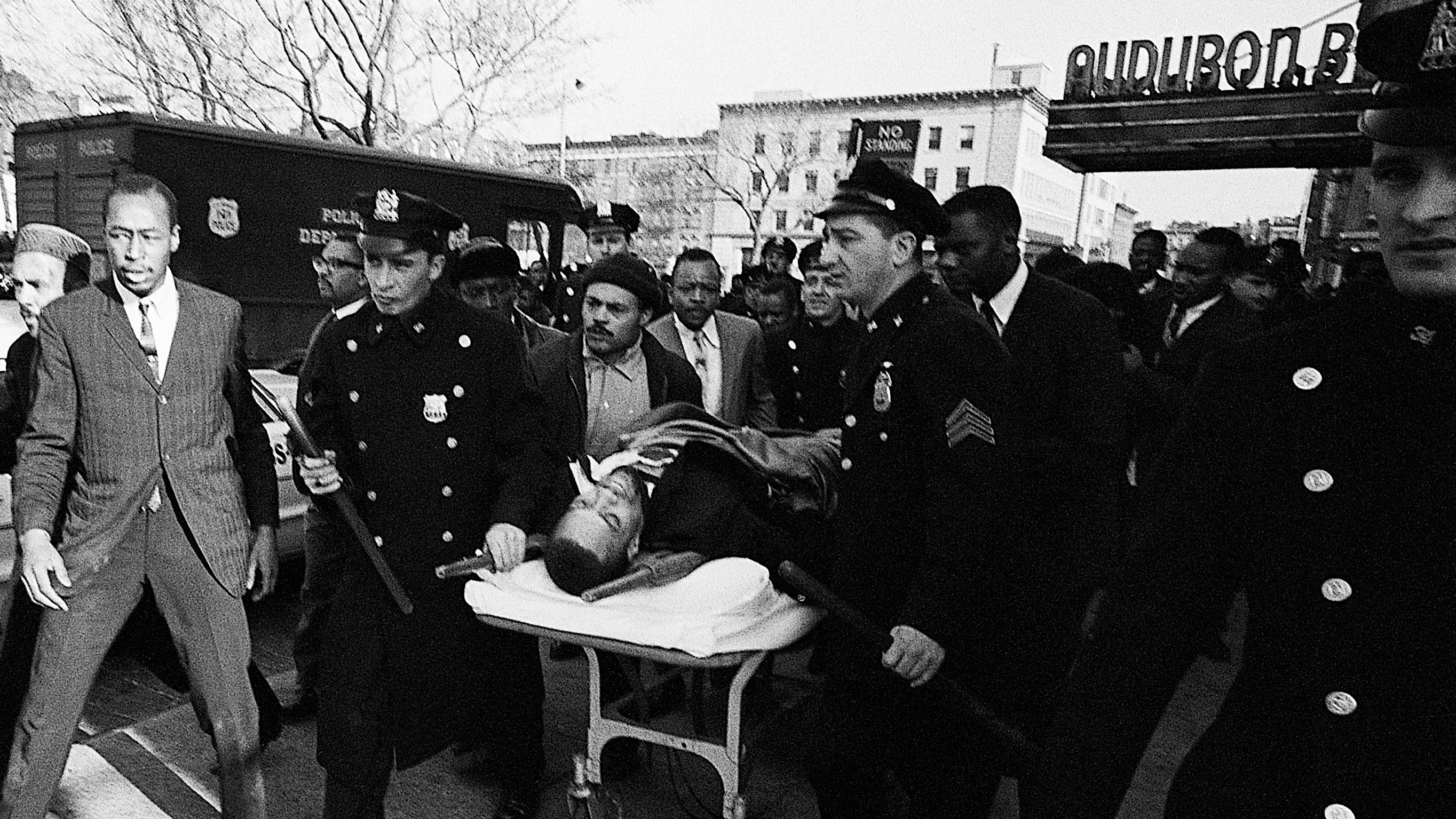 Police Carry Stretcher with Malcolm X&#039;s Body