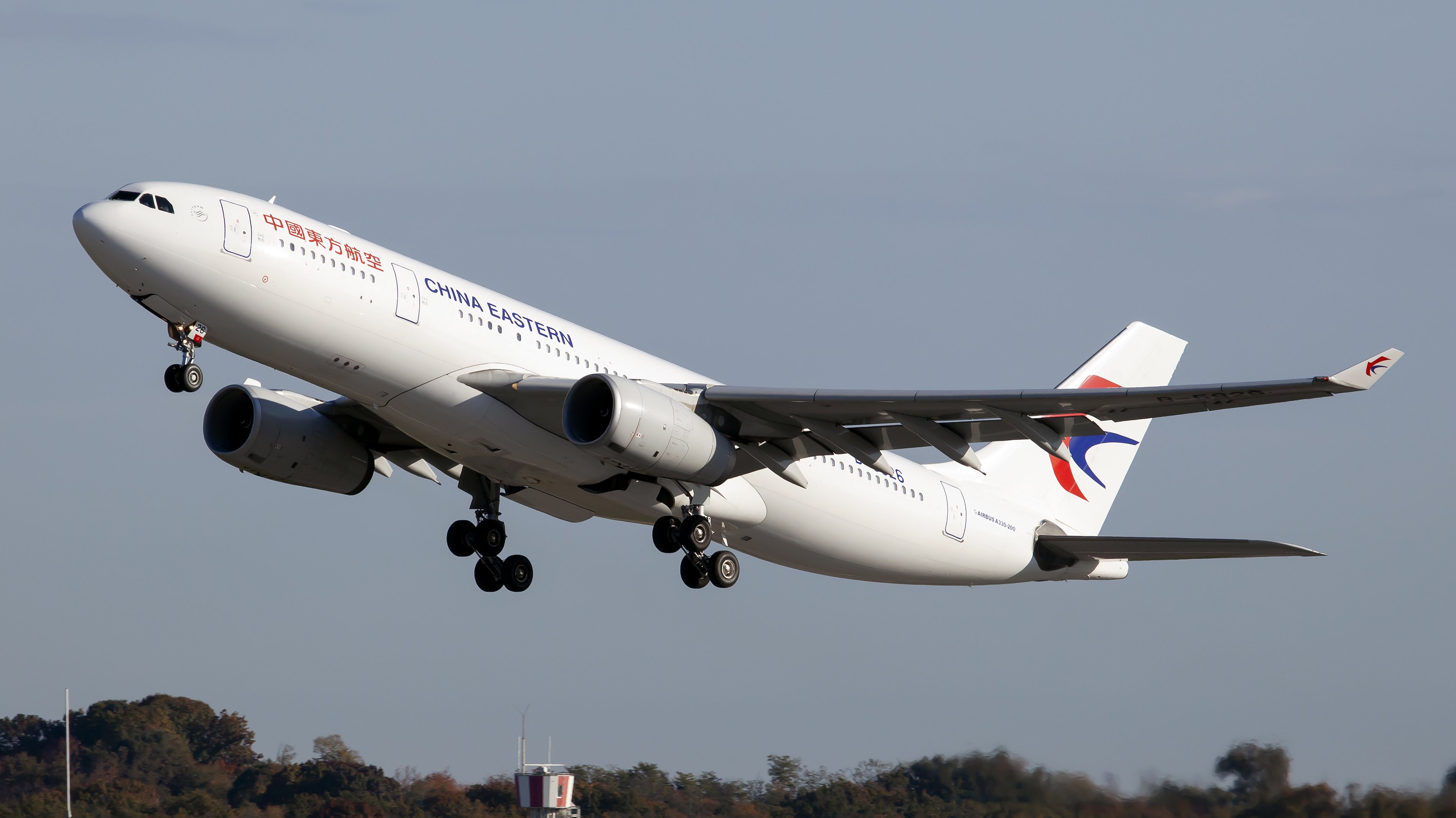 A China Eastern Airlines Airbus 330 taking off from Milan