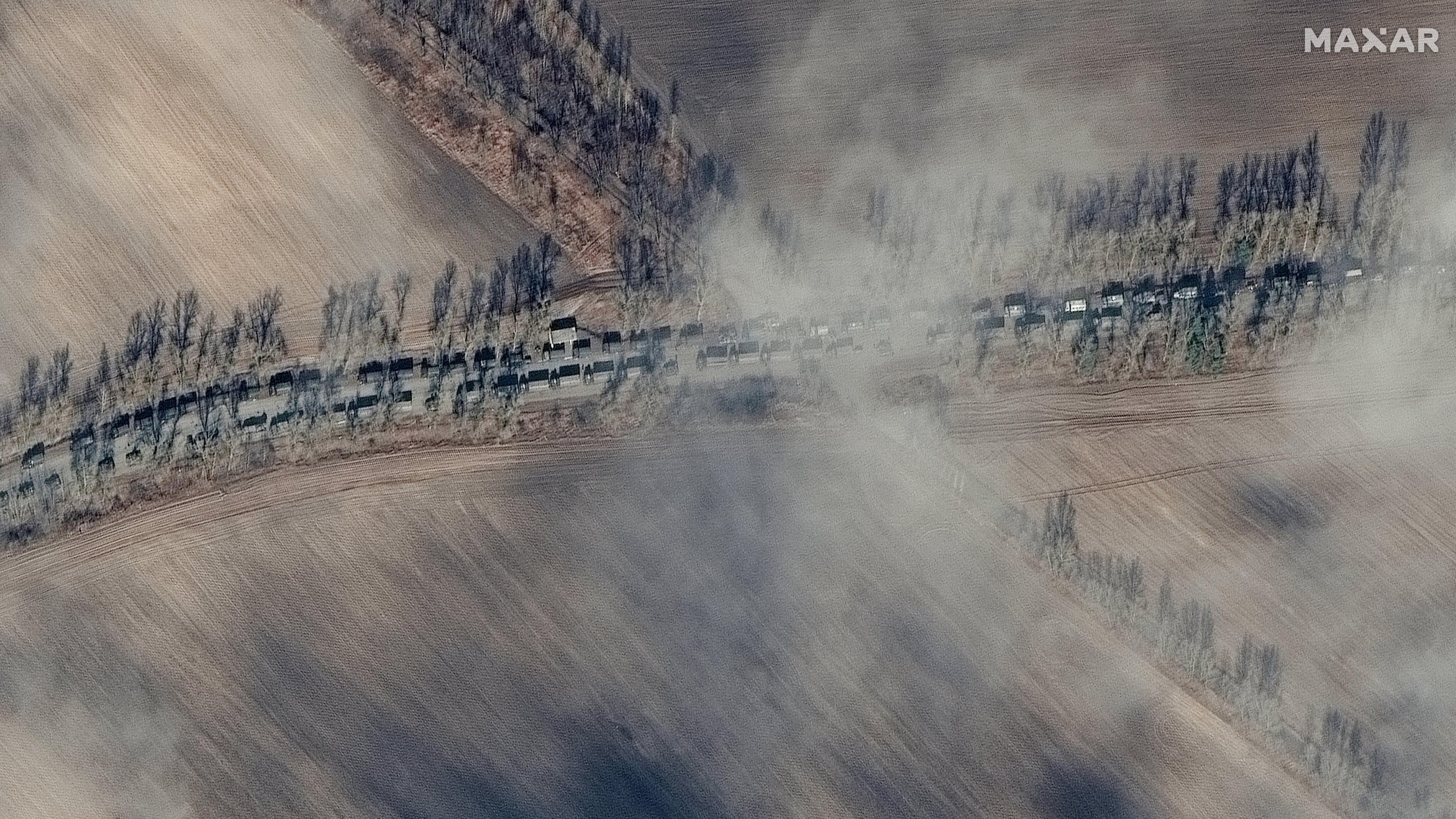 RUSSIANS INVADE UKRAINE -- FEBRUARY 27, 2022:  03 Maxar high-resolution satellite close up view near southern end of armored equipment and ground forces convoy, Ivankiv, Ukraine.  27feb2022_wv3.  Please use: Satellite image (c) 2022 Maxar Technologies.