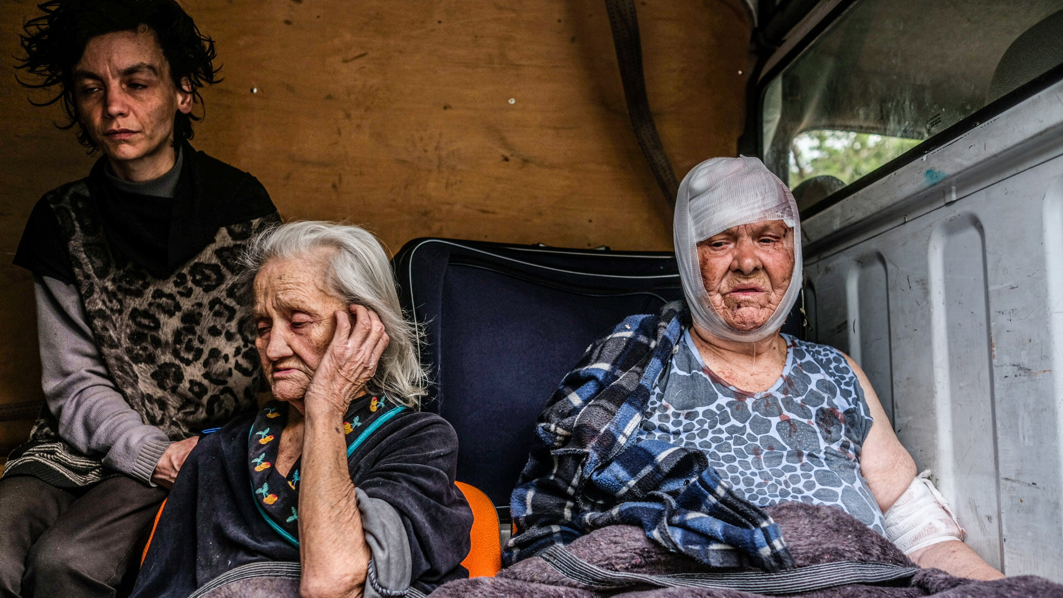 People from Severodonetsk are seen on a van that will take
