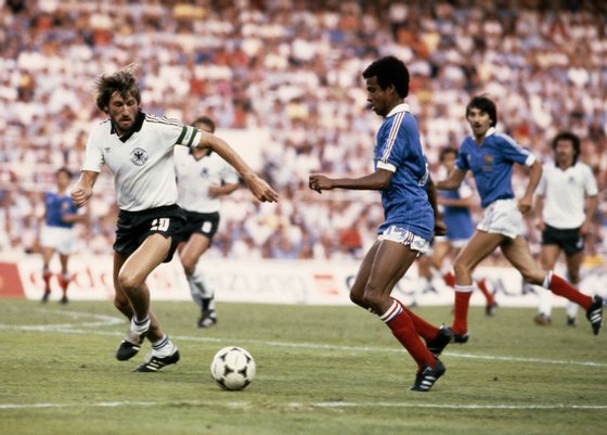 Jean Tigana of France in action against Manfred Kaltz of West Germany during the 1982 FIFA World Cup Semi Final on 8th July 1982 at the Ramon Sanchez Pizjuan Stadium in Seville, Spain. (Photo by Steve Powell/Getty Images)