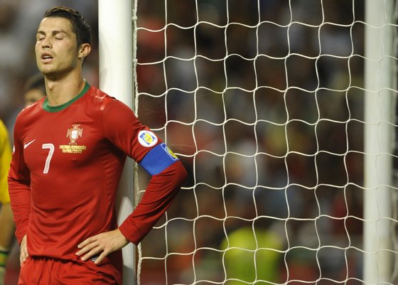 Portugal's forward Cristiano Ronaldo reacts after loosing a chance to score a goal during the World Cup 2014 qualifying football match Portugal between and Azerbaijan at the AXA Stadium in Braga, northern Portugal, on September 11, 2012. AFP PHOTO / MIGUEL RIOPA        (Photo credit should read MIGUEL RIOPA/AFP/GettyImages)