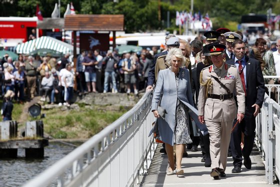 RANVILLE, NORMANDY - JUNE 05:  Prince Charles, Prince of Wales, Colonel-in-Chief, Army Air Corps, and Camilla, Duchess of Cornwall visit Pegasus Bridge during the D Day 70 Commemoration on June 5, 2014 in Ranville, France.  (Photo by Jonathan Brady - WPA Pool / Getty Images)