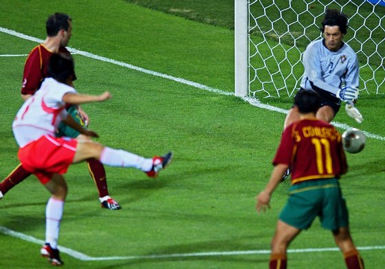 INCHEON, REPUBLIC OF KOREA:  Korea's Park Ji Sung (L) shoots past Portuguese 'keeper Vitor Baia to score in the 71st minute as Jorge Costa (L/top) and Sergio Conceicao (R) look on , 14 June 2002 at the Incheon Munhak Stadium in Incheon, prior to first round Group D action between Portugal and Korea in the 2002 FIFA World Cup Korea/Japan. Korea leads Portugal 1-0.  AFP PHOTO/PASCAL GUYOT (Photo credit should read PASCAL GUYOT/AFP/Getty Images)