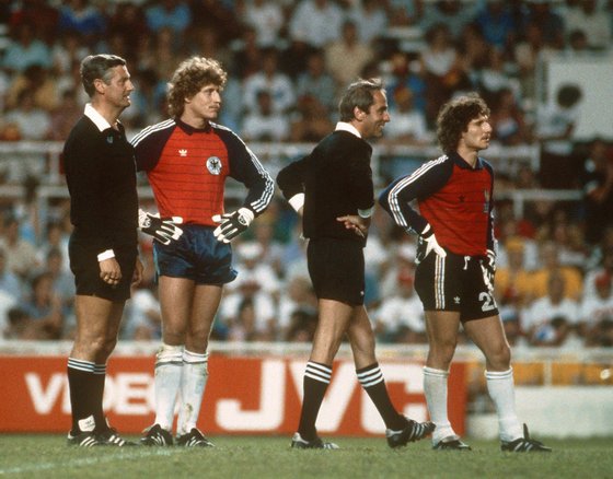 SEVILLA, SPAIN - JULY 8:  West German and French goalkeepers Harald Schumacher (2nd L) and Jean-Luc Ettori (R) stand on the field next to the referees during a break in the World Cup semifinal soccer match between West Germany and France. AFP PHOTO  (Photo credit should read STAFF/AFP/Getty Images)