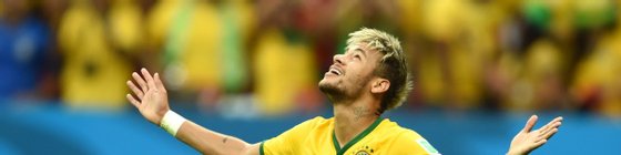 Brazil's forward Neymar celebrates after scoring during a Group A football match between Cameroon and Brazil at the Mane Garrincha National Stadium in Brasilia during the 2014 FIFA World Cup on June 23, 2014.       AFP PHOTO / FRANCOIS XAVIER MARIT