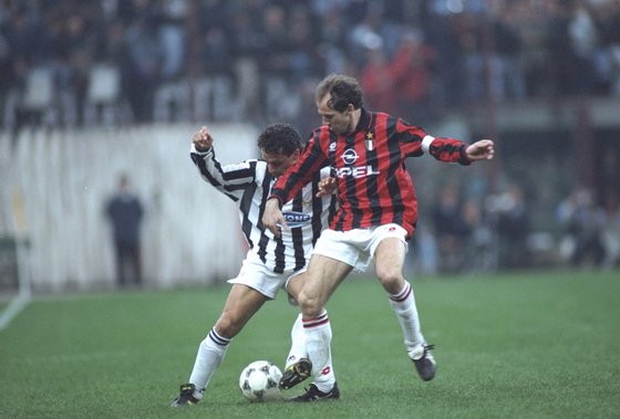 1 Apr 1995:  Robertio Baggio (left) of Juventus takes on Franco Baresi (right) of AC Milan during a Serie A match at the San Siro Stadium in Milan, Italy. Juventus won the match 2-0.   Mandatory Credit: Allsport UK /Allsport