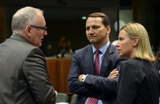 (From L) Dutch Foreign Minister Frans Timmermans, Polish Foreign Minister Radoslaw Sikorski and Italian Foreign Minister Federica Mogherini confer prior to a meeting of Foreign Affairs Minister of the European Union and Asia at the EU Council building in Brussels on July 23, 2014. AFP PHOTO / THIERRY CHARLIER        (Photo credit should read THIERRY CHARLIER/AFP/Getty Images)