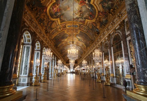 Versailles, FRANCE: TO GO WITH AFP STORY IN FRENCH BY FABIENNE FAUR : "LA GALERIE DES GLACES A VERSAILLES A RETROUVE SON ECLAT" View taken 22 June 2007 shows the "Hall of Mirrors" at Versailles castle, west of Paris, painted by French artist Charles Le Brun (1619-1690) following its complete 12 million euros renovation provided by the French construction and services giant Vinci. More than 300 years after its completion in 1684, the newly-revamped jewel in the crown of the Chateau de Versailles will be unveiled to the public, 25 June after four years of labour by a squad of architects, art historians, carpenters and, above all, specialist arts craftsmen. AFP PHOTO THOMAS COEX (Photo credit should read THOMAS COEX/AFP/Getty Images)