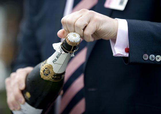 CHESTER, ENGLAND - MAY 10: Opening of a bottle in the champagne bar at Chester racecourse on May 10, 2012 in Chester, England. (Photo by Alan Crowhurst/Getty Images)