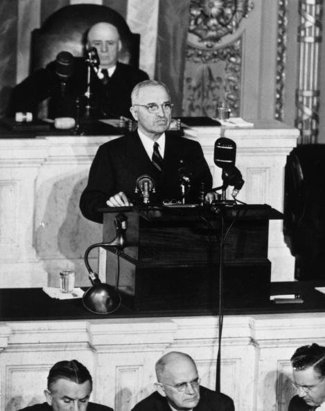 US President Harry S. Truman (1884 - 1972) speaking to Congress from the rostrum in the House of Representatives, behind him is the Democratic Speaker of the House Sam Rayburn (1882 - 1961), October 23, 1945.  (Photo by Keystone/Getty Images)