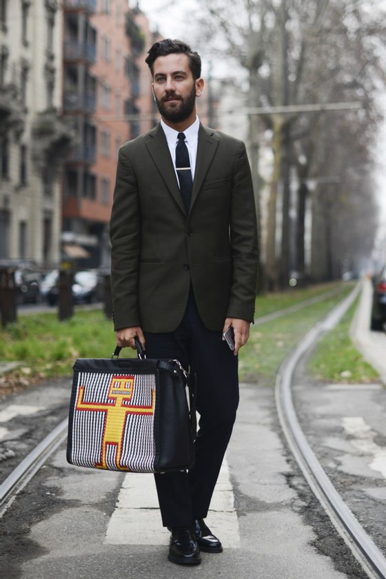 MILAN, ITALY - JANUARY 19: Matthew Zorpas poses wearing an Acne suit and Fendi bag during day 3 of Milan Menswear Fashion Week Fall/Winter 2015/2016  on January 19, 2015 in Milan, Italy.  (Photo by Vanni Bassetti/Getty Images)