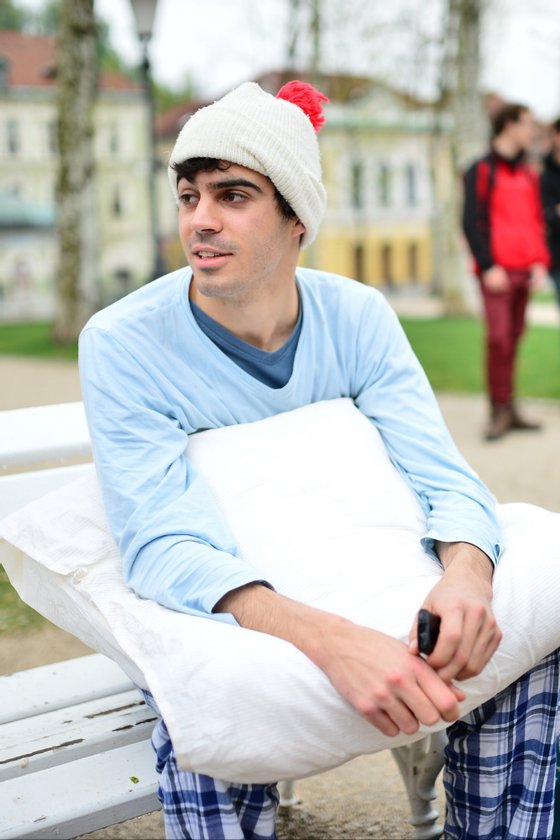 A young man wearing his pajamas waits for the start of the pillow fight on an International Pillowfight Day in Ljubljana, Slovenia on April 5, 2014. AFP PHOTO / Jure Makovec        (Photo credit should read Jure Makovec/AFP/Getty Images)
