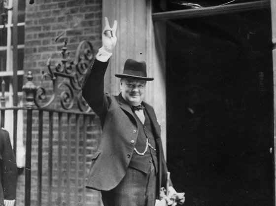Prime Minister Winston Churchill outside 10 Downing Street, gesturing his famous 'V for Victory' hand signal, June 1943.  (Photo by H F Davis/Getty Images)