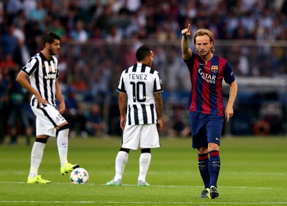 BERLIN, GERMANY - JUNE 6: Ivan Rakitic of FC Barcelona celebrates scoring the opening goal during the UEFA Champions League Final match between Juventus and FC Barcelona at the Olympiastadion on June 6, 2015 in Berlin, Germany. (Photo by Chris Brunskill Ltd/Getty Images)