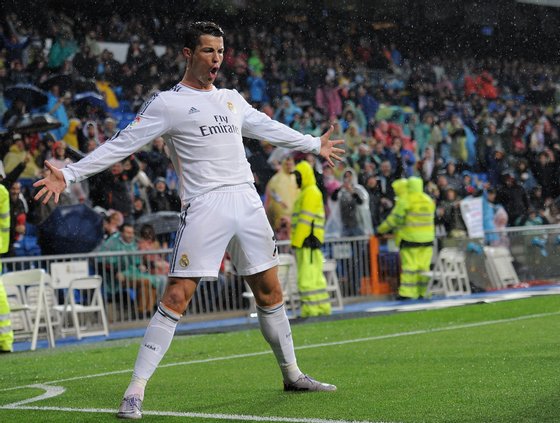 MADRID, SPAIN - MARCH 29:  Cristiano Ronaldo of Real Madrid FC celebrates after scoring his team's opening goal during the La Liga match between Real Madrid CF and Rayo Vallecano de Madrid at Santiago Bernabeu stadium on March 29, 2014 in Madrid, Spain.  (Photo by Denis Doyle/Getty Images)