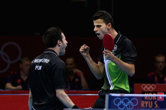 LONDON, ENGLAND - AUGUST 05: Joao Monteiro and Tiago Apolonia of Portugal celebrate during Men's Team Table Tennis quarterfinal match against team of Korea on Day 9 of the London 2012 Olympic Games at ExCeL on August 5, 2012 in London, England. (Photo by Feng Li/Getty Images)