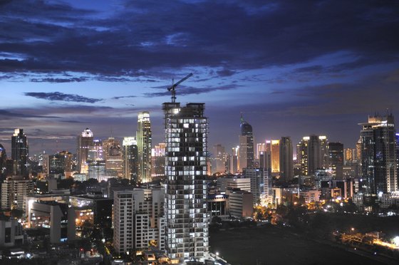 In this photograph taken on January 27, 2013, the Jakarta skyline is seen at dusk. Indonesia is expected to grow 6.3 percent in 2013 after expanding this year by 6.1 percent, the World Bank said in their December 18, 2013 report. AFP PHOTO / ROMEO GACAD (Photo credit should read ROMEO GACAD/AFP/Getty Images)