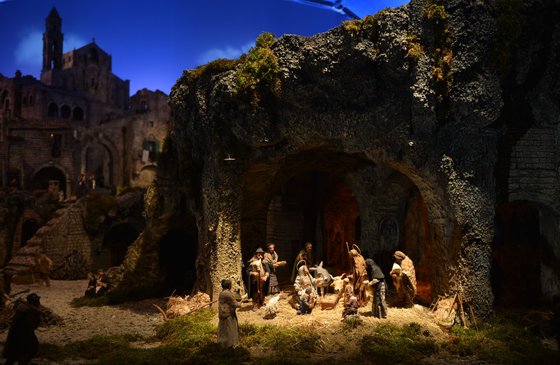 This picture taken on December 24, 2012 shows the crib in St Peter's Square at the Vatican, at the end of the unveiling ceremony. Pope Benedict XVI will celebrate a late Christmas night holy mass at St. Peter's Basilica to mark the nativity of Jesus Christ. AFP PHOTO / VINCENZO PINTO (Photo credit should read VINCENZO PINTO/AFP/Getty Images)
