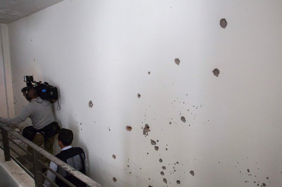 Bullet holes on a wall in the house where five alleged gang members were killed in the military operation which resulted in the recapture of Joaquin "El Chapo" Guzman, in Los Mochis city, Sinaloa State, Mexico on January 11, 2016. Mexican marines recaptured fugitive drug kingpin Joaquin "El Chapo" Guzman on January 8 in the northwest of the country, six months after his spectacular prison break embarrassed authorities. AFP PHOTO/HECTOR GUERRERO / AFP / HECTOR GUERRERO (Photo credit should read HECTOR GUERRERO/AFP/Getty Images)