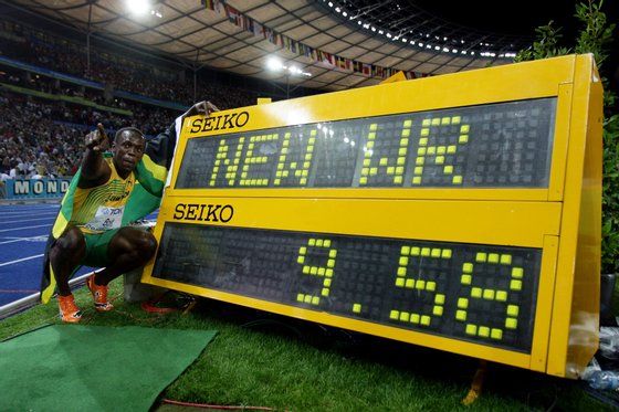 BERLIN - AUGUST 16: Usain Bolt of Jamaica celebrates winning the gold medal in the men's 100 Metres Final during day two of the 12th IAAF World Athletics Championships at the Olympic Stadium on August 16, 2009 in Berlin, Germany. Bolt set a new World Record of 9.58. (Photo by Mark Dadswell/Getty Images)