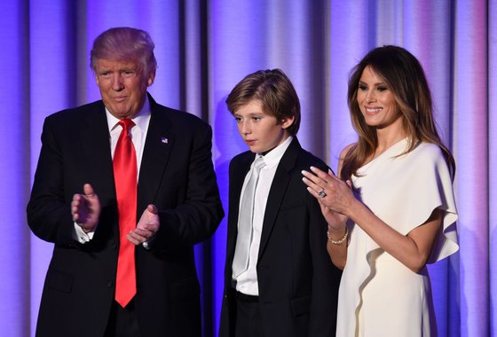 TOPSHOT - US President-elect Donald Trump arrives with his son Baron and wife Melania at the New York Hilton Midtown in New York on November 8, 2016. Trump stunned America and the world Wednesday, riding a wave of populist resentment to defeat Hillary Clinton in the race to become the 45th president of the United States. / AFP / SAUL LOEB (Photo credit should read SAUL LOEB/AFP/Getty Images)