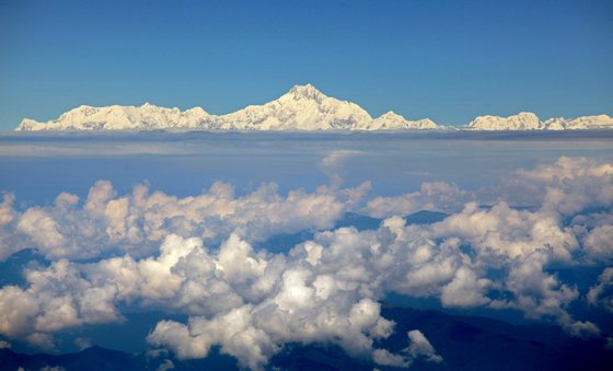 Photo taken on September 30, 2010 shows Mount Everest (C) from the window of a Druk Air aircraft during a flight from Bangkok to Paro. Everest is the world's highest mountain above sea level at 8,848 metres (29,029 feet) high. AFP PHOTO / ED JONES (Photo credit should read Ed Jones/AFP/Getty Images)