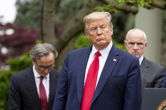 epa08363150 US President Donald J. Trump listens during a news conference in the Rose Garden of the White House in Washington, DC, USA, 14 April 2020. Trump announced that he has instructed his administration to halt funding to WHO, the World Health Organization. EPA/Stefani Reynolds / POOL